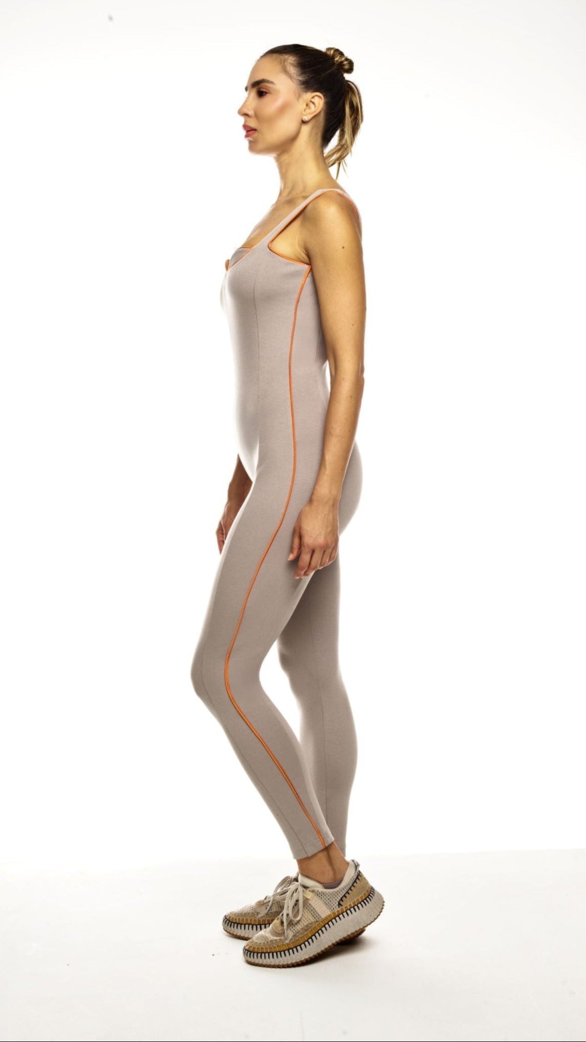 Taupe bodysuit in stretch jersey with orange piping trim